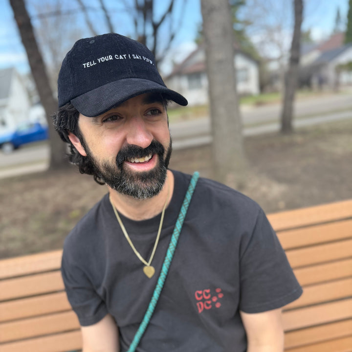 Man wearing a baseball cap smiling