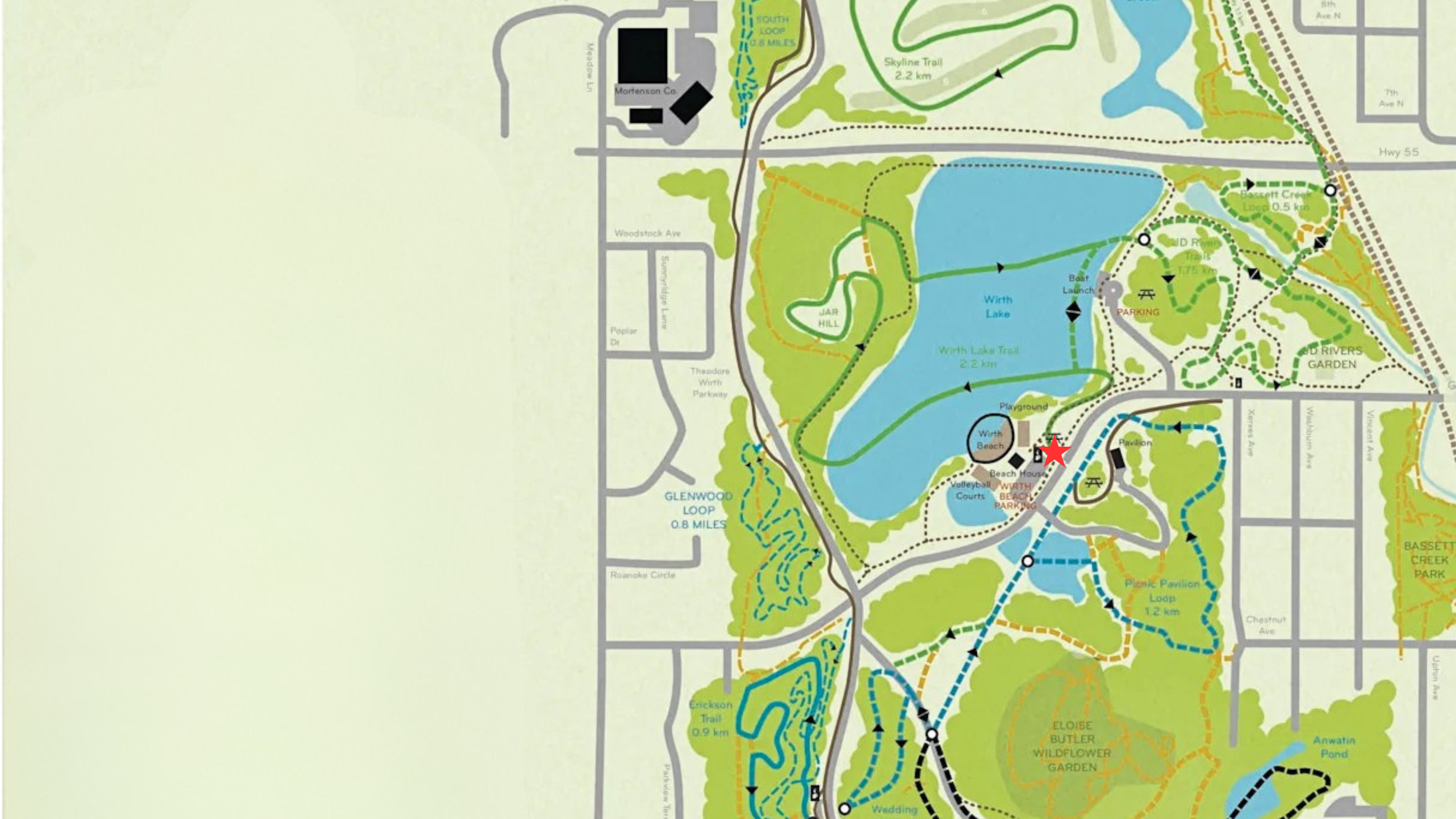 A stylized park map or trail diagram showing green landscaped areas, blue water features, roads, and labeled paths on a pale background.